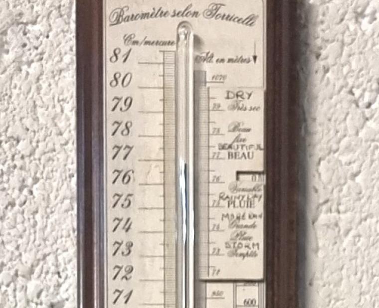 Reproduction French Torricelli mercury stick barometer with alcohol thermometer signed for Panchet in Paris, 1928. Arched topped mahogany case with edge moulding and white background register bearing black engraved indexes showing Centimetres of mercury and Fahrenheit and Centigrade temperature scales together with an altitude compensation scale. The mercury tube includes a gilt brass manually adjusted historical pressure indicator.    Height - 37" and width - 4". 