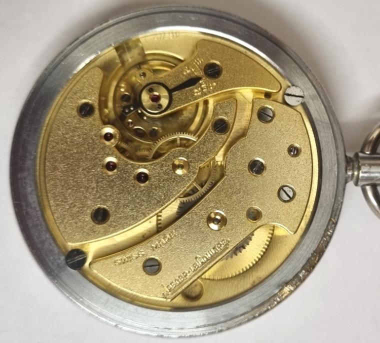 Swiss Jaeger leCoultre chrome plated cased ex-military pocket watch c1940 with top wind and time change. Signed white enamel dial with part luminous Arabic hours with blued steel luminous insert hands and subsidiary seconds dial at 6 o'clock. Signed Swiss 17 jewel jewelled lever calibre 467/2 movement with the case back externally marked '6E/50 A17747' and internally numbered 250365.