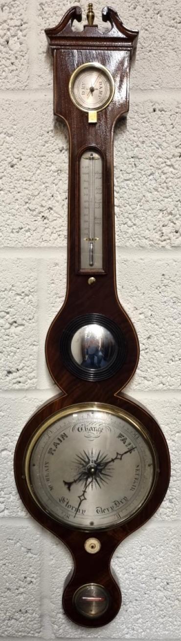 English mid to late C19th mahogany cased mercury wheel barometer with hygrometer and mercury Fahrenheit thermometer. Swan neck pediment with brass finial and boxwood stringing throughout the lower casework. Circular brass bezel with convex glass over a silvered dial engraved with black inches of mercury pressure index and a blued steel pressure indicating hand with a gilt history marker. The alcohol spirit level indicator at the case bottom signed for 'R.D.Gant' of 'Woodbridge'. Height - 38" and width - 10".