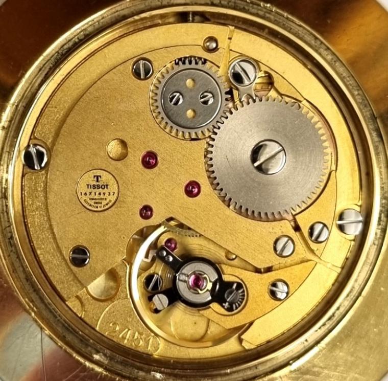 Swiss Tissot gold plated dress pocket watch with top wind and time change. Signed silvered dial with black baton hours and matching hands with gilt sweep seconds hand. Signed Swiss 17 jewel jewelled lever movement calibre 2451 numbered 16714937 with the 20 micron gold plated case signed and designated 41310.
